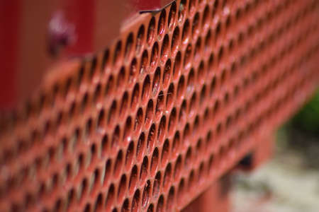 Cutting from the grid at the bottom of the fence. Elements of the design of fences.