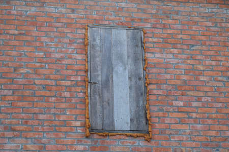 The wooden door of the attic. Detached house in the village.