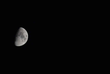 The moon in the night sky. Two thirds of the moon.の写真素材