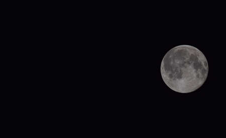 The moon in the night sky. Two thirds of the moon.の写真素材