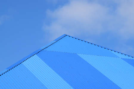 Blue roof metal sheets. Modern types of roofing materials.の写真素材