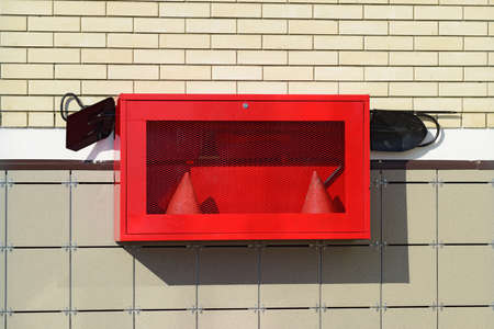 Fire Shield on the wall. Set primary fire extinguishing equipment.の写真素材