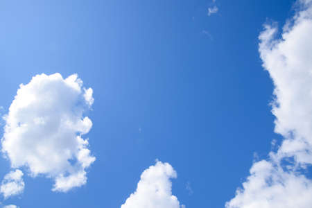 Bright midday blue sky with clouds. Heavenly landscape.
