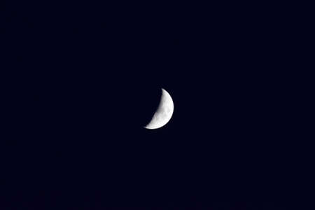 The moon in the night sky. Two thirds of the moon.の写真素材