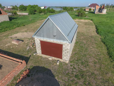Top view of the garage in a private plot of land. Private construction.の写真素材
