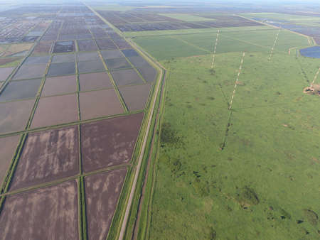 Masts longwave antennas communication among the rice fields flooded. Telecommunications and...