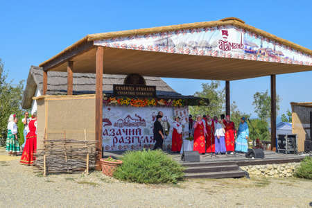 Russia, Ataman - 26 September 2015: Folk singer at a concert in the Cossack village of Ataman. Folk songs.のeditorial素材