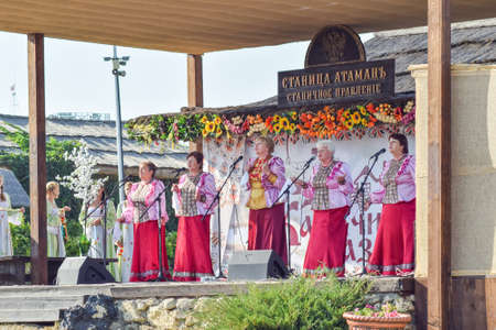 Russia, Ataman - 26 September 2015: Folk singer at a concert in the Cossack village of Ataman. Folk songs.のeditorial素材