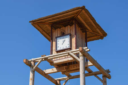 The wooden clock tower. for time tracking in a village in the old days.の写真素材