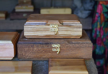 Wooden boxes on the counter. Wooden souvenirs in the form of boxes with locks.
