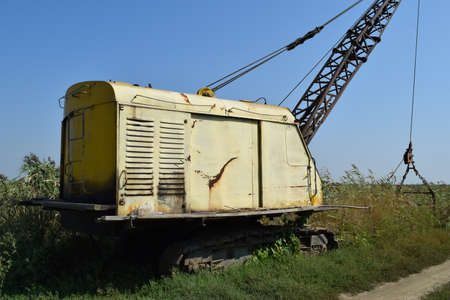 Old quarry near the dragline. Old equipment for digging the soil in canals and quarries.の写真素材