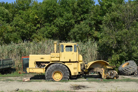 Big yellow tractor. Old Soviet agricultural machinery.の写真素材