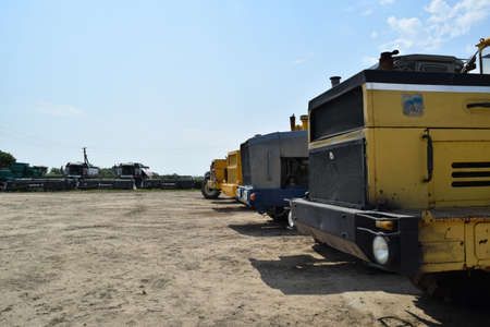 Russia, Temryuk - 15 July 2015: Tractor, standing in a row. Agricultural machinery. Parking of...