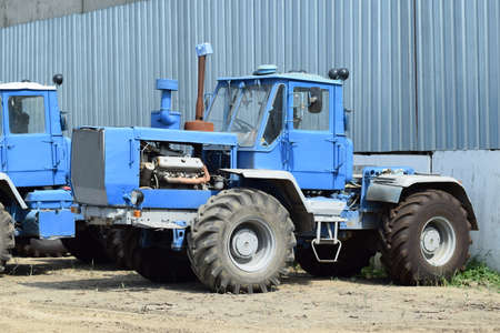 Russia, Temryuk - 15 July 2015: Tractor, standing in a row. Agricultural machinery. Parking of...