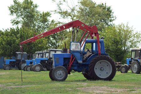 Russia, Temryuk - 15 July 2015: Tractor, standing in a row. Agricultural machinery. Parking of...