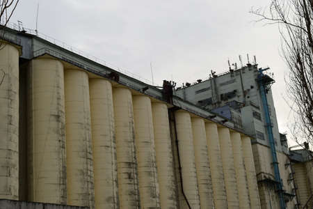 Building for storing and drying grain. Soviet-built elevator.の写真素材