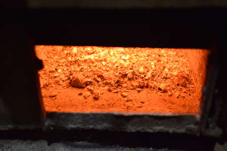 Hot coals in the stove. Red burned by heating the particles tree.