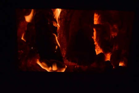 Hot coals in the stove. Red burned by heating the particles tree.の写真素材