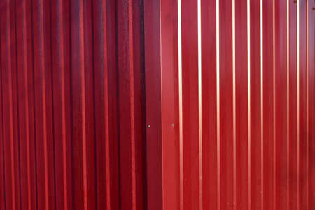 Diagonal pattern of metal profile. Fences from the galvanized iron painted by a polymeric covering.の写真素材