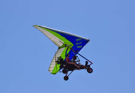 Russia, Veselovka - September 6, 2016: Trike, flying in the sky with two people. Extreme...