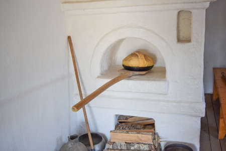 Bread in the Russian oven. Recreated image of antiquity.の写真素材