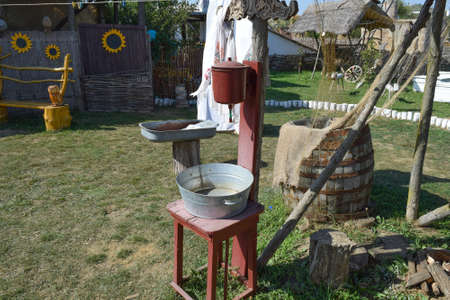 Washbasin with a basin in the yard. The old way of life in the village.の写真素材