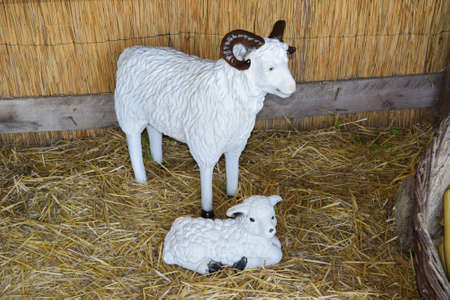 Mannequins and kid goats in the barn. Art presentation of the contents of goats n aferme.の写真素材