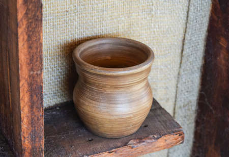 Shelves with standing on their utensils of porcelain and earthenware. Vintage kitchen utensils.の写真素材