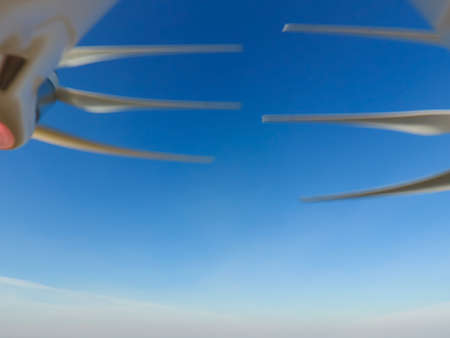 Propellers quadrocopters against the sky and sun. Quadrocopters propellers on the background of the...