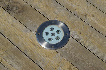 LED outdoor light for illumination, built-in wooden floor.の写真素材