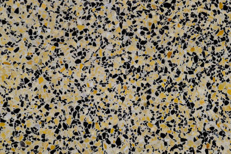 Marble tiles interspersed with granite. The texture of paving slabs.
