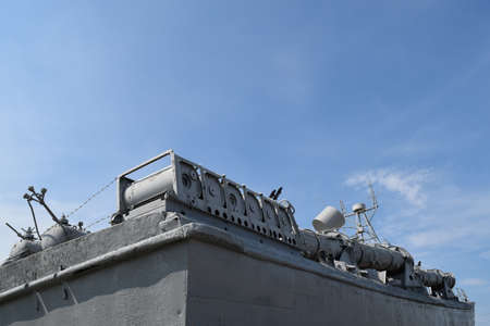 Part of the deck of a warship. communication devices and deck guns