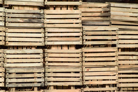 Wooden boxes stacked together. Warehouse empty wooden containers.の写真素材