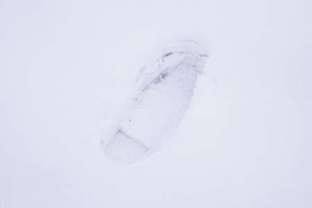 Human footprints in the snow. The path in the snow.の写真素材
