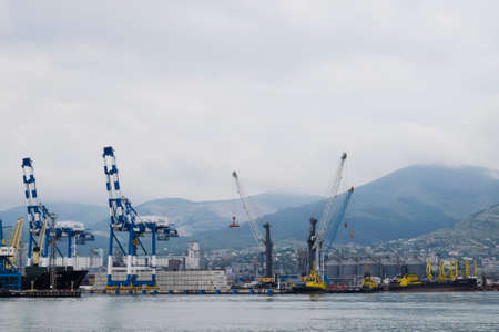Novorossiysk, Russia - May 28, 2016: The international sea port of Novorossiysk. Port cranes and industrial objects. Marine Station.の写真素材