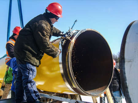 Safety at work. Welding and installation of the pipeline. Industrial weekdays welders and fitters.