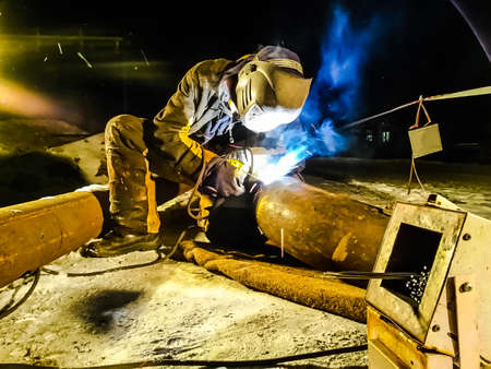 Safety at work. Welding and grinding of iron constructions. Industrial weekdays welders and fitters.