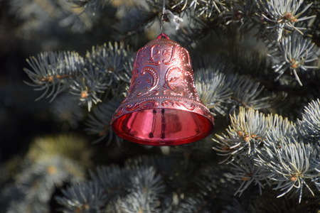 Decorations New Year tree. Tinsel and toys, balls and other decorations on the Christmas Christmas tree standing in the open air.の写真素材