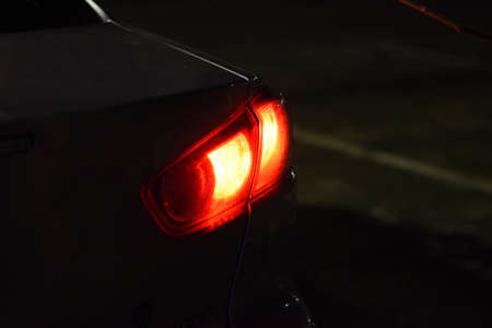 Discounted rear car lights in the dark. Stop signals.の写真素材