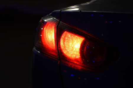 Discounted rear car lights in the dark. Stop signals.の写真素材