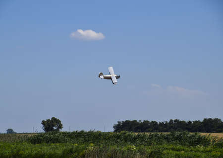 Aircraft agricultural aviation AN-2. The spraying of fertilizers and pesticides on the field with...
