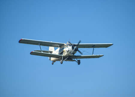 Aircraft agricultural aviation AN-2. The spraying of fertilizers and pesticides on the field with...