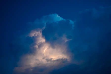 Lightnings in storm clouds. Peals of a thunder and the sparkling lightnings in clouds.