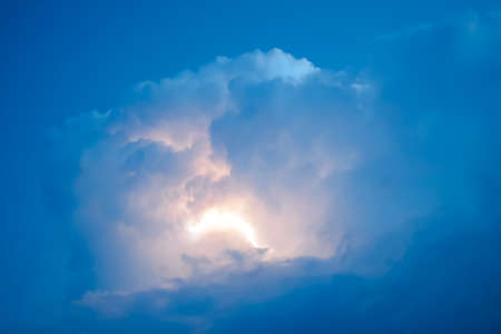 Lightnings in storm clouds. Peals of a thunder and the sparkling lightnings in clouds.の写真素材