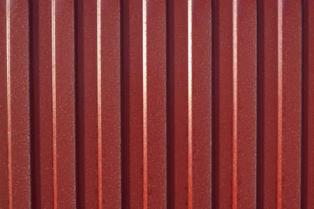 Diagonal pattern of metal profile. Fences from the galvanized iron painted by a polymeric covering.の写真素材