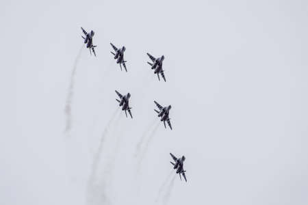 Krasnodar, Russia - February 23, 2017: Air show in the sky above the Krasnodar airport flight school. Airshow in honor of Defender of the Fatherland. MiG-29 in the sky.の写真素材
