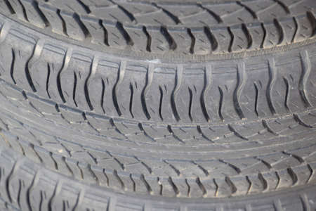 The background of the tread pattern of the car wheel. Rubber tires.の写真素材