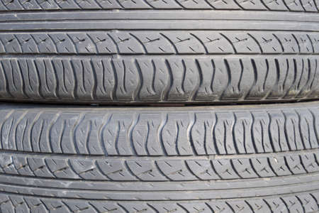 The background of the tread pattern of the car wheel. Rubber tires.