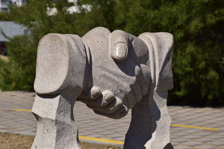 Sculpture handshake. Symbol of friendship and cooperation.の写真素材