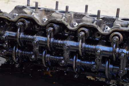 The head of the block of cylinders. The head of the block of cylinders removed from the engine for...